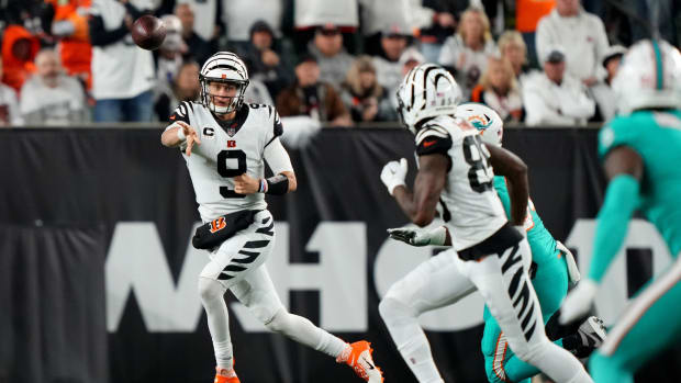 Sep 29, 2022; Cincinnati, Ohio, USA; Cincinnati Bengals quarterback Joe Burrow (9) throws on the run to Cincinnati Bengals wide receiver Tee Higgins (85) in the fourth quarter against the Miami Dolphins at Paycor Stadium in Cincinnati. The Cincinnati Bengals won, 27-15 to improve to 2-2 on the season. Mandatory Credit: Kareem Elgazzar-USA TODAY Sports
